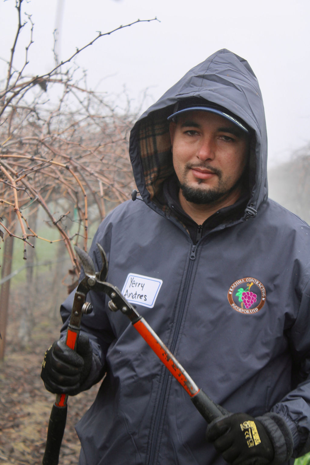 Valley Pruning Contest – California Farmworker Foundation Farmworker smiling during the Central Valley Pruning Contest held by California Farmworker Foundation