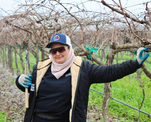 Valley Pruning Contest – California Farmworker Foundation Farmworker smiling during the Central Valley Pruning Contest held by California Farmworker Foundation