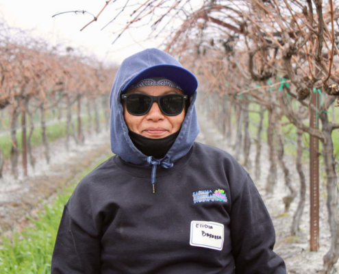 Valley Pruning Contest – California Farmworker Foundation Farmworker smiling during the Central Valley Pruning Contest held by California Farmworker Foundation