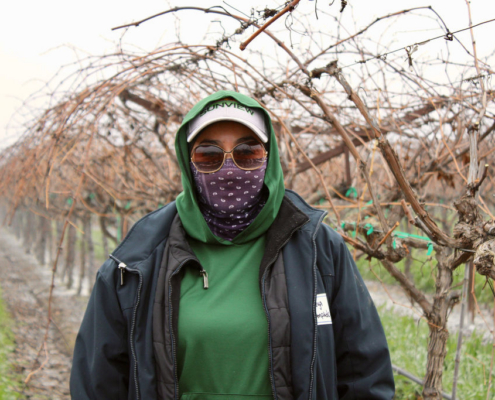 Valley Pruning Contest – California Farmworker Foundation Farmworker smiling during the Central Valley Pruning Contest held by California Farmworker Foundation