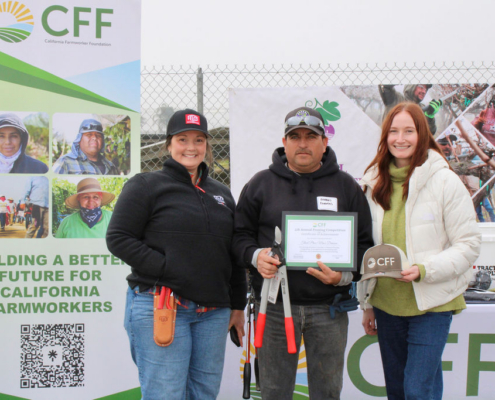 Valley Pruning Contest – California Farmworker Foundation Farmworker smiling during the Central Valley Pruning Contest held by California Farmworker Foundation