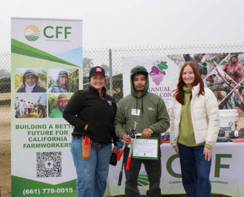 Valley Pruning Contest – California Farmworker Foundation Farmworker smiling during the Central Valley Pruning Contest held by California Farmworker Foundation