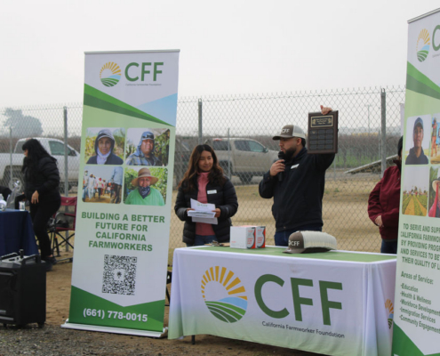 Valley Pruning Contest – California Farmworker Foundation Farmworker smiling during the Central Valley Pruning Contest held by California Farmworker Foundation