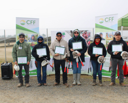 Valley Pruning Contest – California Farmworker Foundation Farmworker smiling during the Central Valley Pruning Contest held by California Farmworker Foundation
