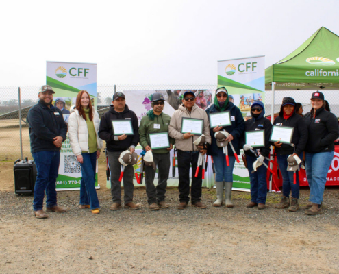 Valley Pruning Contest – California Farmworker Foundation Farmworker smiling during the Central Valley Pruning Contest held by California Farmworker Foundation