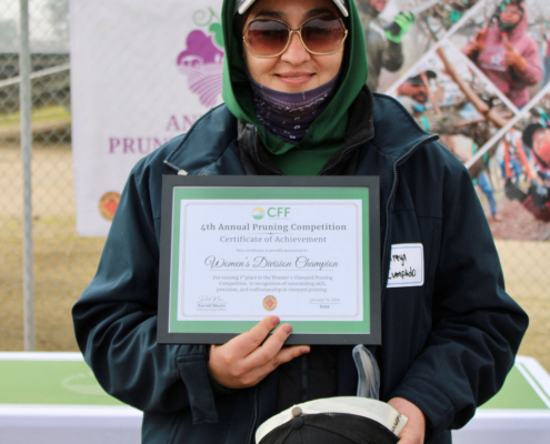 Valley Pruning Contest – California Farmworker Foundation Farmworker smiling during the Central Valley Pruning Contest held by California Farmworker Foundation